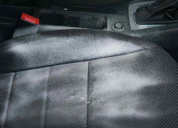 Close-up of dirty leather car seat